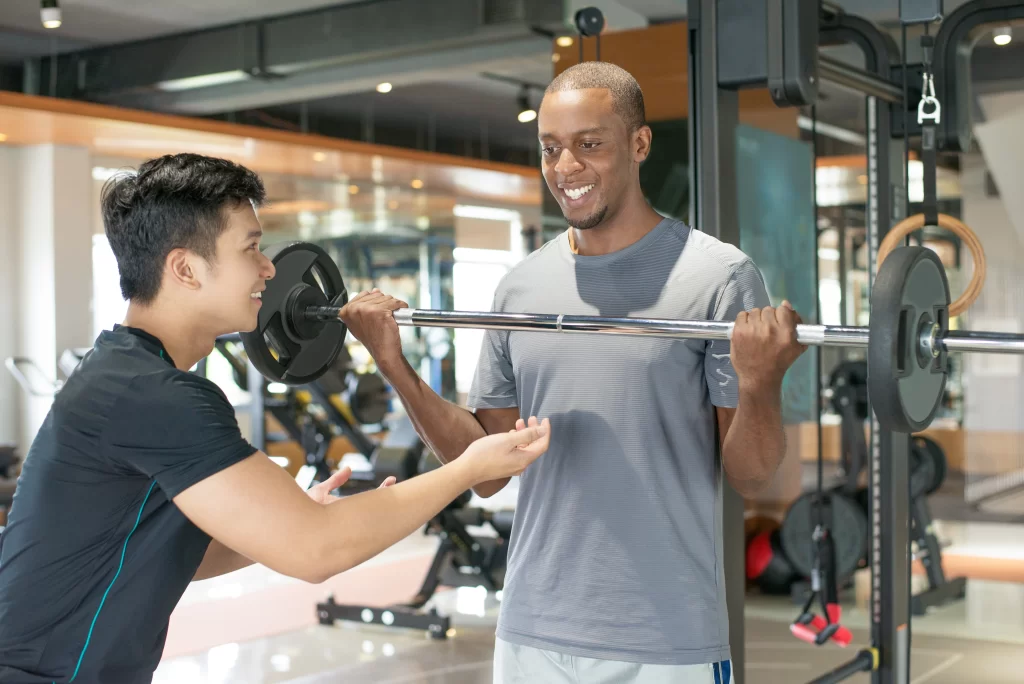 Professional coaches and fitness trainers at Nerul Gymkhana posing in sports facilities