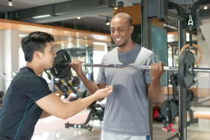 Professional coaches and fitness trainers at Nerul Gymkhana posing in sports facilities